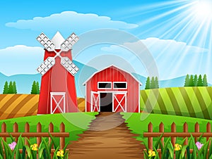 Farm landscape with shed and red windmill on daylight