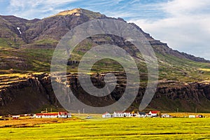 Farm and lodge in the fjord Berufjordur, Iceland photo