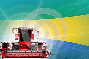Farm machinery modernisation concept, 3 red modern farm combine harvesters on Gabon flag - digital industrial 3D illustration photo