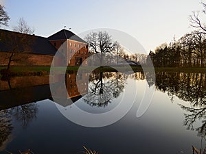 Farm mansion house by a lake in Denmark