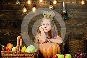 Farm market fall harvest. Harvest festival concept. Kid girl near basket full of fresh vegetables harvest rustic style