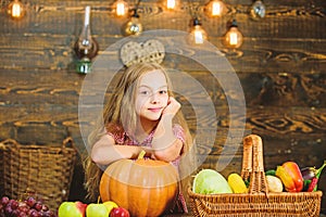 Farm market fall harvest. Harvest festival concept. Kid girl near basket full of fresh vegetables harvest rustic style