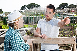 Farm neighbors talk at the border