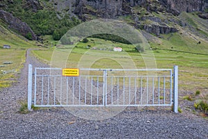 Farm Nupsstadur bihind a closed gate in south Iceland