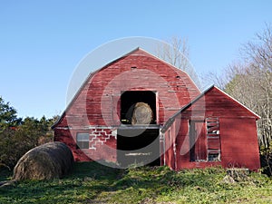 Farm: old red barn with hay bales