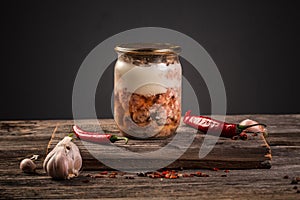 Farm organic food. Canned meat in a glass jar on a wooden table. banner menu recipe place for text