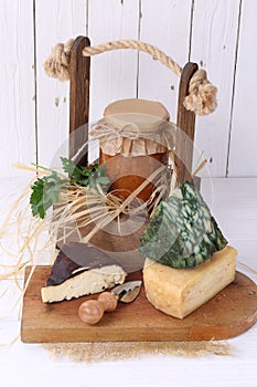 Farm products on white wooden background.