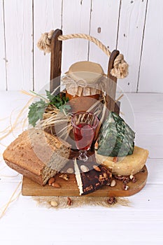 Farm products on white wooden background.