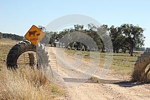 farm property cattle road crossing grid across a dry drought stricken dusty dirt road in rural New South Wales, Australia