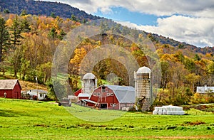 Farm with red barn and silos in Vermont