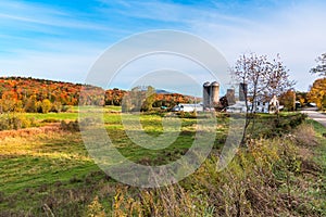 Farm in a rural landscape in Vermont during autumn colour season