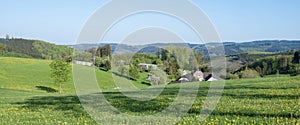 farm in sunny spring sauerland countryside landscape in germany