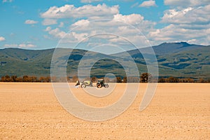 Farm tractor drives in field