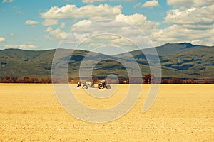 Farm tractor drives in field