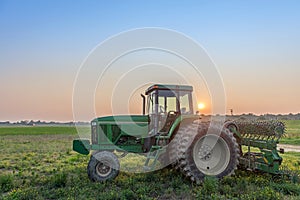 Farm Tractor in a field on a Maryland Farm at sunset