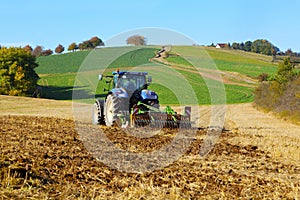 Farm tractor on the field working