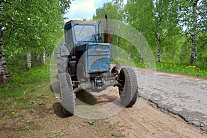 Farm tractor parked on the side of the road