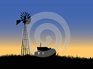 Farm tractor with windmill photo