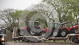 Farm Tractors on Top of a Transport Truck