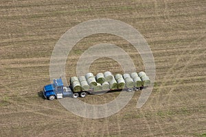 Farm Truck Loading Hay Bales for Dairy Cows