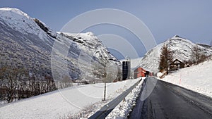 Farm in Valldola river valley on Trollstigen route in snow in Norway