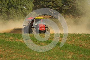 Farm Vehicle spreading lime onto a field