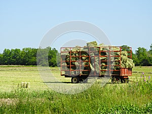 Farm work in a NYS springtime hay field