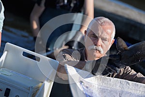 Farmed fisherman harvesting fish