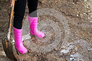 Farmer boots in the soil