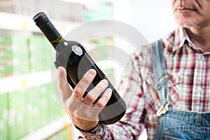 Farmer buying wine at supermarket