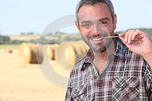 Farmer chewing a straw