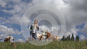 Farmer Child with Cattle on Meadow, Tourist Girl and Cows Animals in Mountains