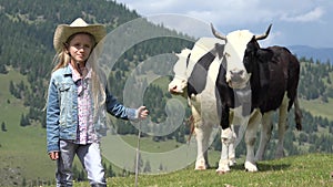 Farmer Child Pasturing Cows, Cowherd Girl with Cattle on Meadow in Mountains 4K
