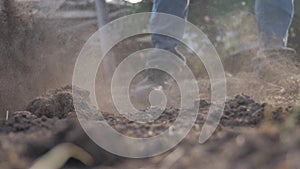 Farmer digging the ground with a shovel garden spade close-up. slow motion video. man farmer working in lifestyle the