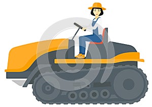 Farmer driving catepillar tractor.