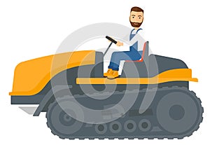 Farmer driving catepillar tractor