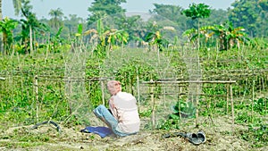 A farmer eating lunch at his field.