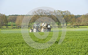 Farmer fertilizing crops