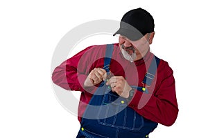 Farmer fiddling with the fastener on his bib