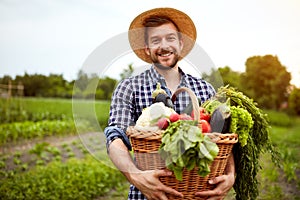 Farmer with freshly picked vegetables in basket