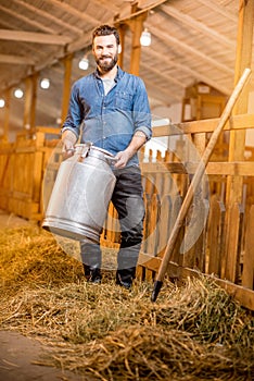 Farmer in the goat barn