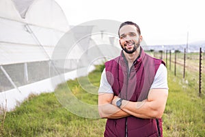 Farmer, greenhouse farm and portrait of happy man on firle outdoors. Young sustainability farming, eco friendly business