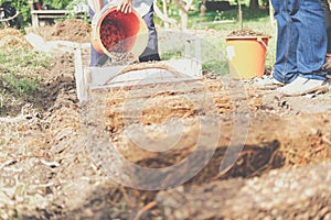 Farmer growing straw mushroom on rice straw