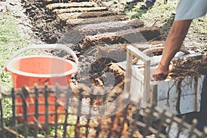 Farmer growing straw mushroom on rice straw