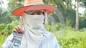 Farmer hands gesture for using user interface and mobile technology with blank space for cyber and futuristic concept in nature fa