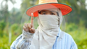 Farmer hands gesture for using user interface and mobile technology with blank space for cyber and futuristic concept in nature fa