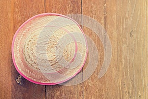 Farmer hat on table with vintage tone copy space.