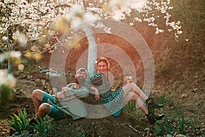 A farmer and his wife standing in their field. Smile Couple on farmland. Family of rural workers. Couple Gardener