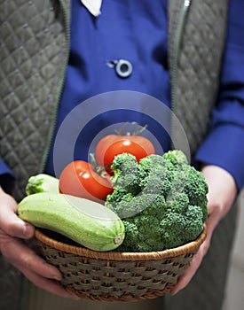 Farmer holding fresh tomato