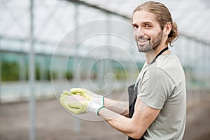 Farmer holding mineral fertilizers